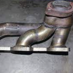 What should I do if the exhaust manifold leaks oil?